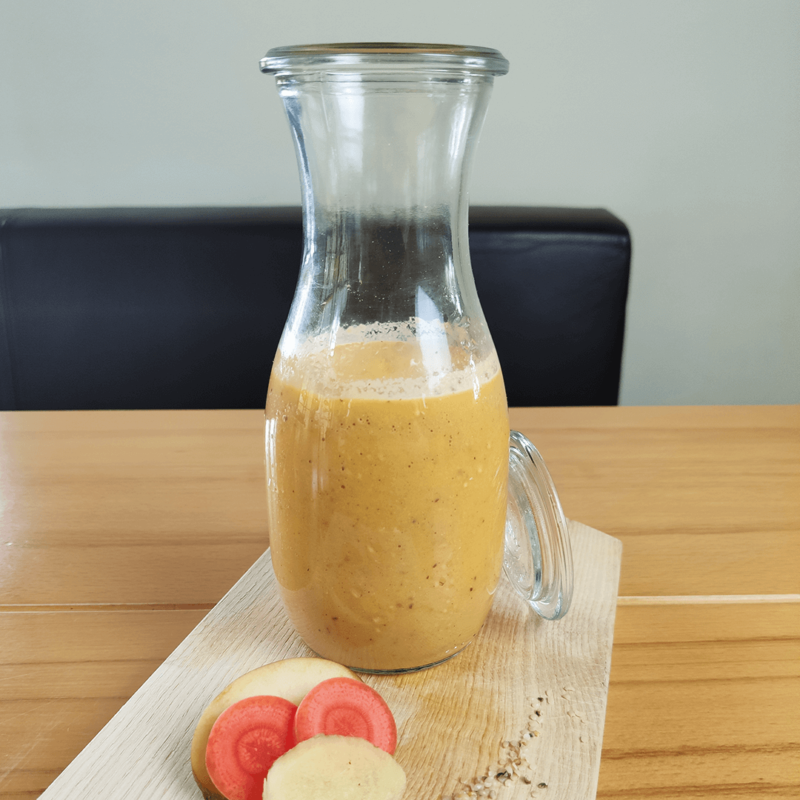 Smoothie with hemp seeds, carrot, apple and ginger